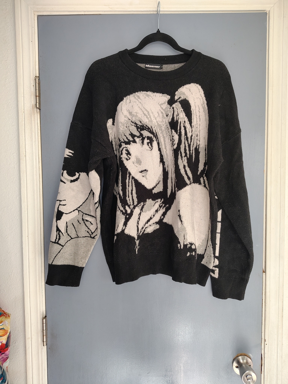 Graphic Anime-Style Black & Cream Women’s Sweater